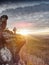 Female outdoor adventure photographer is seen from behind