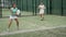 Female paddle tennis player during couple match at court