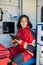 Female paramedic posing for the camera in the ambulance car