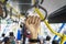 Female passengers hold handles on Transjakarta bus
