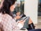 Female Passengers Using Smartphones While Waiting For Flight