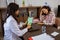 female patient is dizzy consulting a doctor holding a tablet