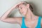 Female patient do head healthy pressure exercises