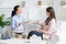 Female patient and psychotherapist having positive inspiring conversation