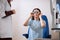 Female patient putting on some trial glasses