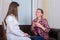 Female patient receives medical consultation from female doctor at home