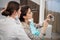 A female patient taking a selfie with her doctor