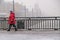 female pedestrians cross the bridge during the fallen wet snow