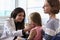 Female Pediatrician Examining Child In Hospital