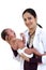 Female pediatrician holds newborn baby