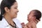 Female pediatrician holds newborn baby