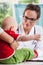 Female pediatrician with little patient