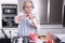 Female pensioner active in the kitchen