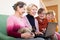 Female pensioners with laptop indoor