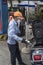 Female petrol station staff wears a large mask to protect herself from the contamination of the virus, in Ho Chi Minh City