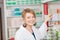 Female Pharmacist Choosing Medicine From Shelf