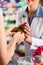 Female pharmacist in her pharmacy with a client