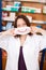 Female Pharmacist Holding Mask With Smiley