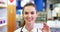 Female pharmacist holding a pill box in a pharmacy