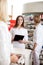 Female Pharmacist Holding Tablet Pc