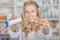 Female Pharmacist Holding Toothpaste And Toothbrush