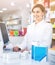 Female pharmacist offering help in choosing at counter in pharmacy