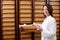 Female Pharmacist Searching Medicines In Shelf