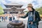 A female photographer burning the incense stick