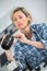 Female photographer cleaning camera with vacuum pump