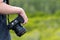 Female photographer holding dslr camera