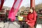 Female photographer rest in the lakeside pavilion of qingmingshanghetu park in hengdian studios, adobe rgb