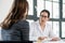 Female physician listening to her patient during consultation