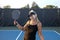 Female Pickleball Player Posing at Net