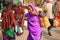 Female Pilgrim Carries Personal Items On Her Back During Indian Pilgrimage