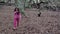 Female pink child and black dog in a autumnal forest slow motion FDV