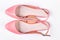 Female pink sandals, white background.