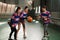 Female players of high school in court. Sports team of earnest, determined young women playing indoor gym with