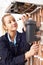 Female Plumber Working On Central Heating Boiler