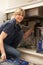 Female Plumber Working On Sink