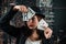 Female poker player beautifully dressed with exquisite perfume with cards in hands at the casino table