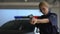 Female police officer aiming gun into criminal, dangerous work, crime prevention