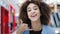 Female portrait indoors happiness contented african american curly woman girl showing direction to camera with index