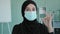Female portrait in office Islamic successful businesswoman in black hijab wears medical mask Arab Muslim lady boss