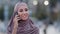 Female portrait outdoors close up face muslim woman islamic girl wears hijab on head friendly answers call standing on