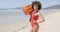 Female posing with rescue float on beach