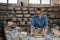 Female potter flattening the clay with rolling pin