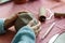 Female pottery artist preparing clay for molding. Close Up view of woman hands with clay. Creative handmade craft