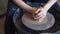 Female pottery hands at work close up