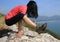 Female practicing yoga on seaside