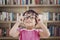 Female preschooler in library